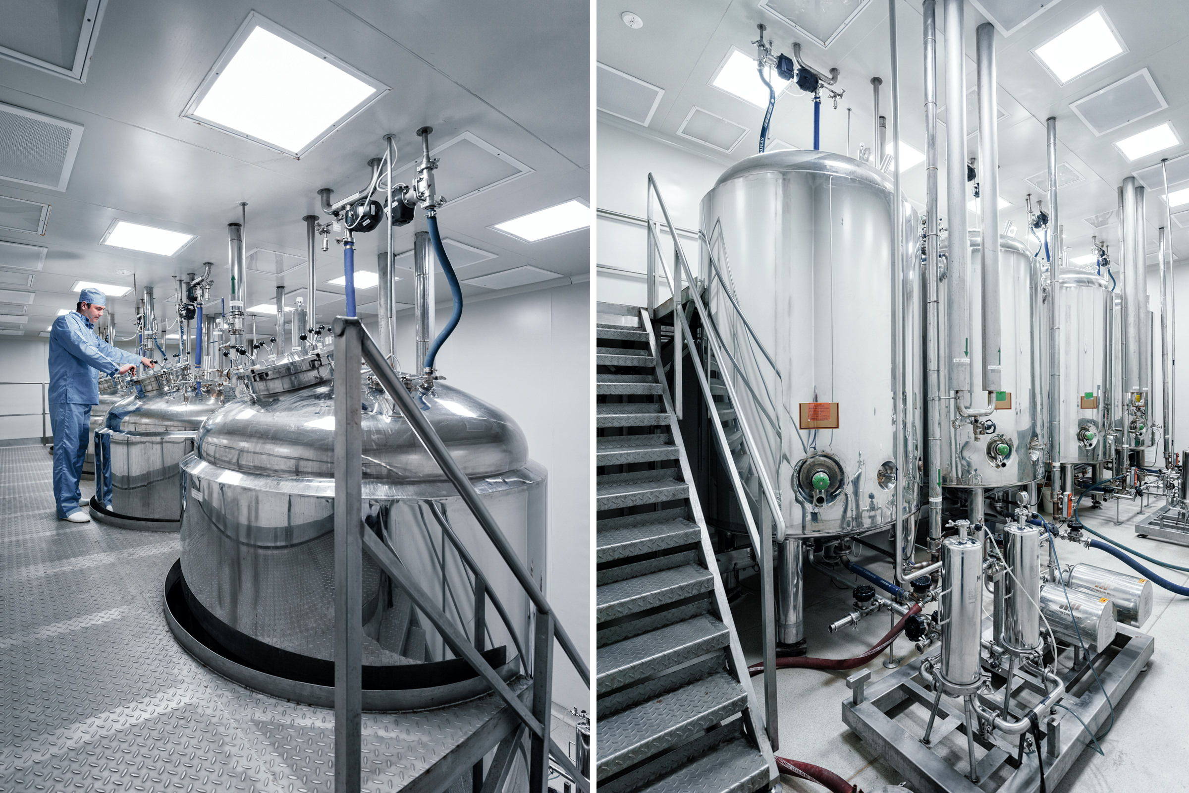 Фото промышленного оборудования в цехе по производству медецинских препаратов, резервуары для хранения жидких компонентов с обслуживающим инженером