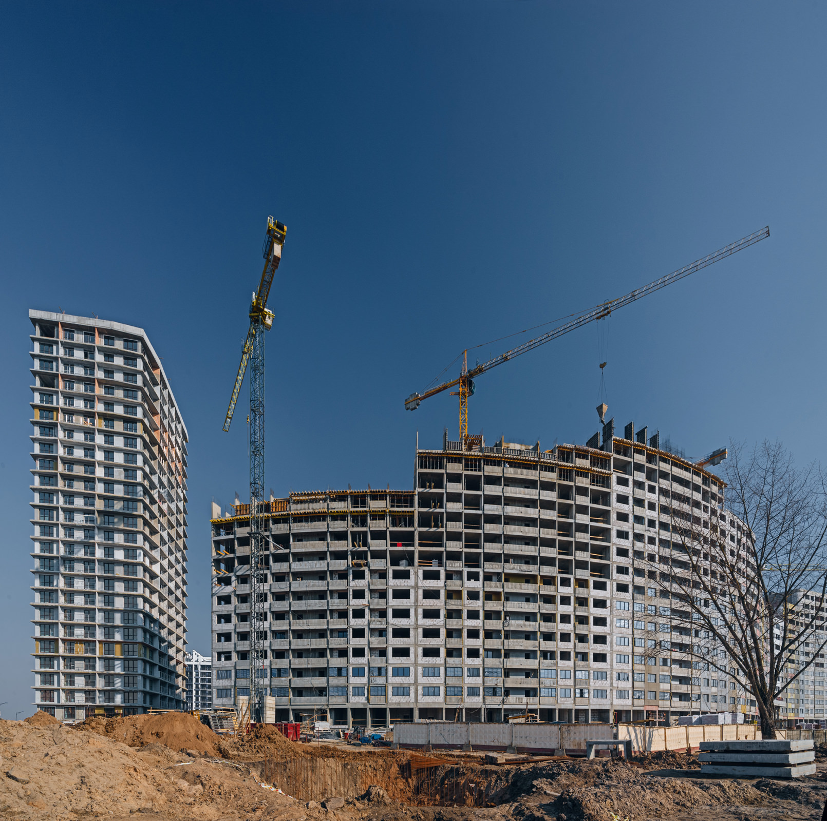 Исполнительная съемка строительного объекта по заказу производителя изоляционного материала, фото возведения многоэтажного жилого дома в комплексе Минск-Мир